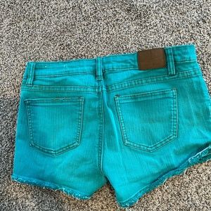 Junior size 9 green cut off shorts